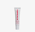 Moisturizing lip balm from Topicals Slick Salve in Pomegranate shown as a single white tube standing upright on a white background.